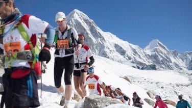 photo of runners challenging the Everest Marathon in stunning morning light.