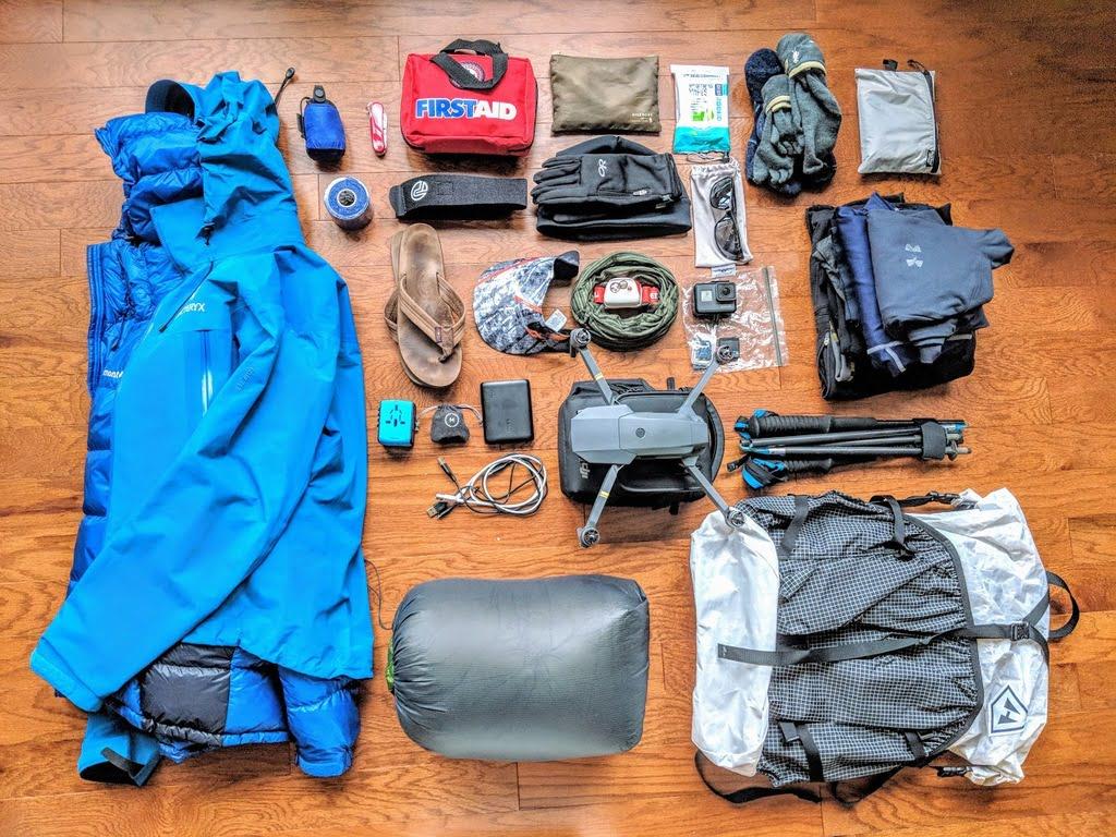 Alt text: A group of trekkers in Nepal with essential gear, against Himalayan mountains backdrop.